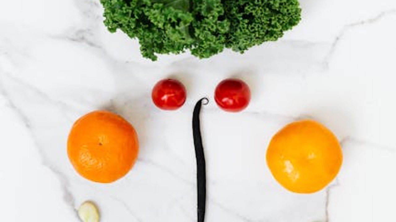 Fresh vegetables, grains and proteins laid out on a kitchen counter