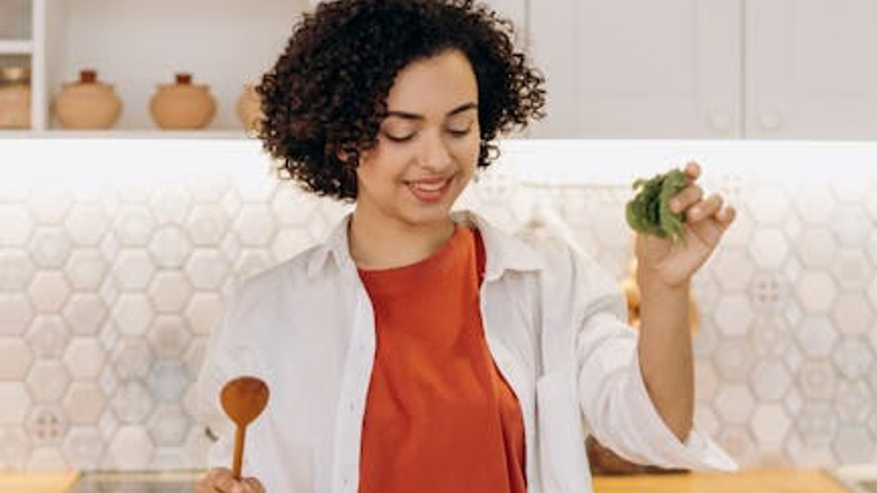 A person cooking a heart-healthy meal in the kitchen